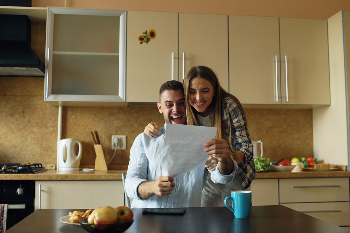Homeowner reviewing paperwork at a kitchen table